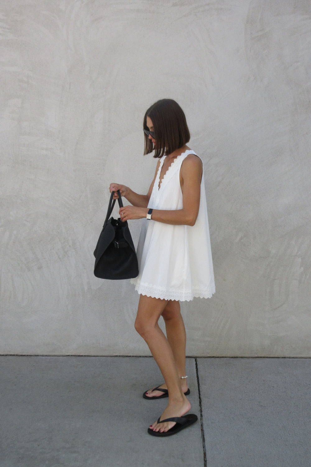Annabel Sleeveless V Neck Mini Dress in White By DISSH Annabel Sleeveless V Neck Mini Dress in White By DISSH