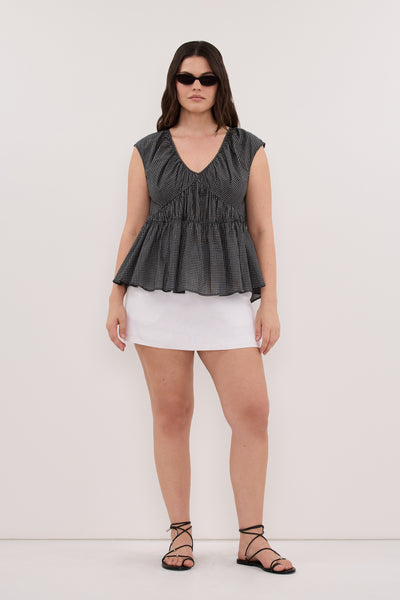 Jasmine wearing ARABELLA BLACK CHECK TOP