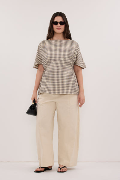 Jasmine wearing ODESSA BEIGE CHECK SIDE TIE TOP
