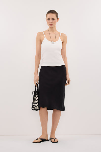 Stas wearing LOUISA BLACK CUPRO KNEE LENGTH SKIRT