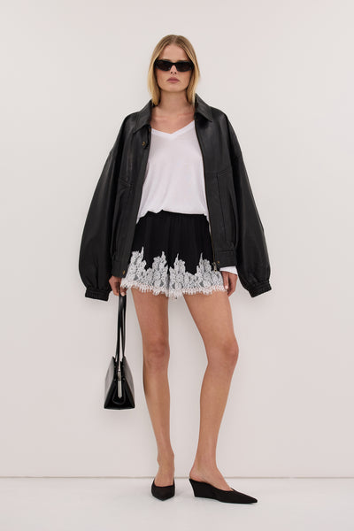 Zoe wearing AMELINE BLACK SATIN SHORT