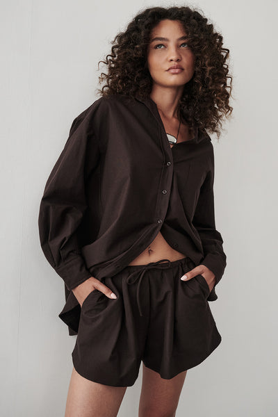 Carol wearing RHEA 2.0 BURNT CHOC OVERSIZED COTTON SHIRT
