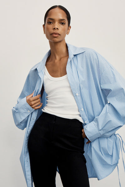 Kristen wearing MATHILDE BLUE STRIPE SIDE TIE SHIRT