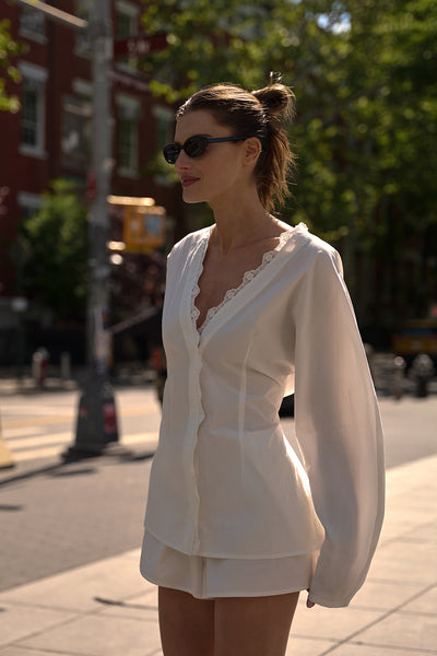 Coco wearing LUCETTE WHITE LACE TRIM COTTON TOP