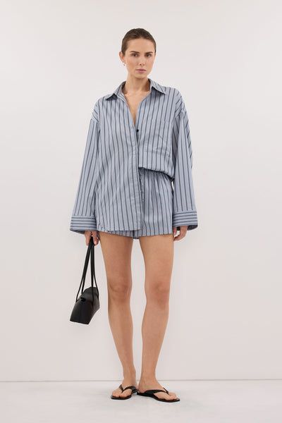 Stas wearing FABLE DUSTY BLUE SILK BLEND SHIRT