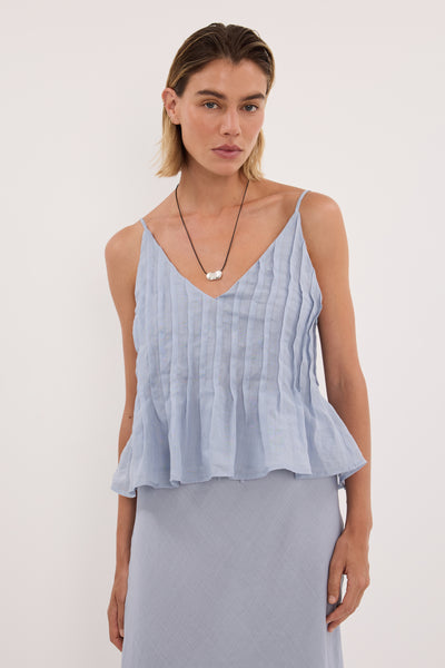 Joanna wearing TAHLIA DUSTY BLUE RAMIE TOP