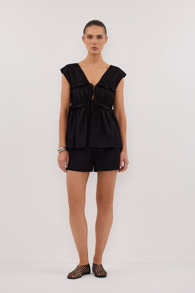 Stas wearing QUINN BLACK LINEN RUFFLE TOP