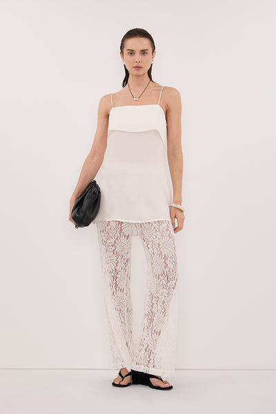 Stas wearing IDA WHITE SLEEVELESS FOLDOVER CAMI TOP