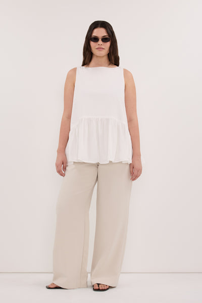 Jasmine wearing JO WHITE COTTON DROP WAIST TOP
