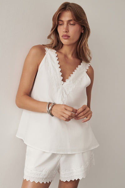 Yulia wearing ANNABEL WHITE V NECK TOP