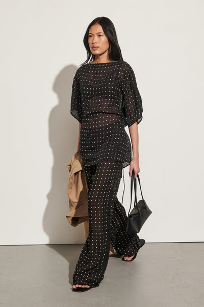 Ploy wearing VANESSA BLACK SPOT PRINT TEE