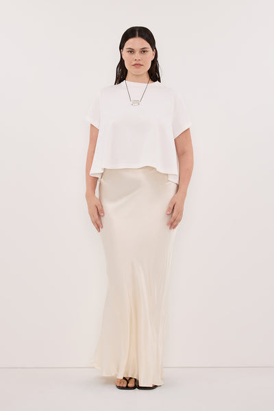 Jasmine wearing CHARLI CREAM SATIN MAXI SKIRT