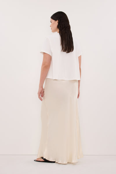Jasmine wearing CHARLI CREAM SATIN MAXI SKIRT