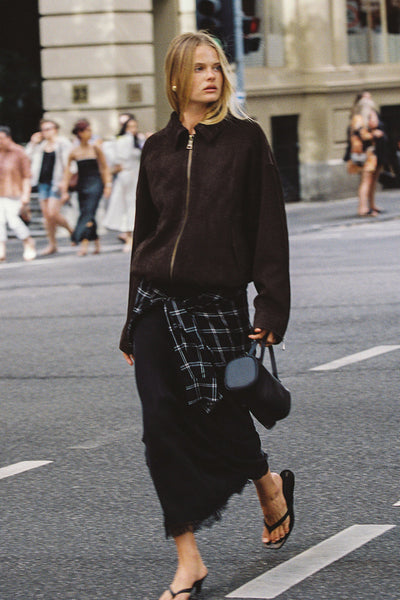 Zoe wearing ANDREA BLACK CUPRO MIDI SKIRT