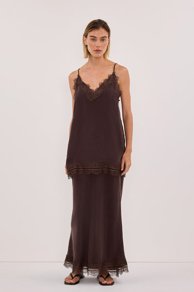 Joanna wearing ANDREA PLUM CHOC CUPRO MIDI SKIRT