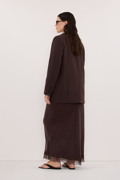 Jasmine wearing ANDREA PLUM CHOC CUPRO MIDI SKIRT