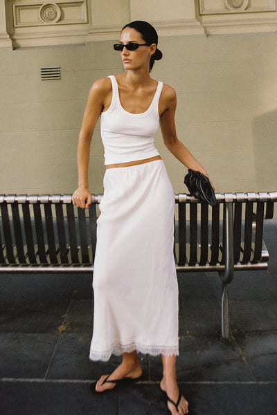 Adrienne wearing ANDREA SANDSTONE CUPRO LACE MIDI SKIRT