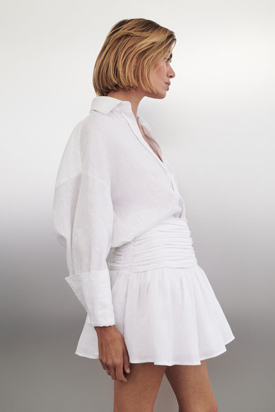 Joanna wearing CATANIA WHITE LINEN MINI SKIRT