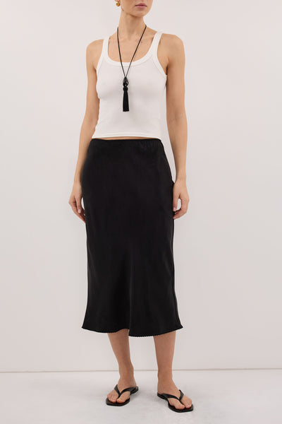Stas wearing ARELIA BLACK CUPRO MIDI SKIRT