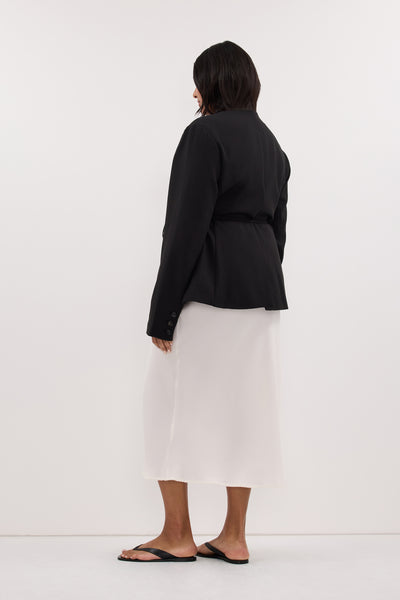 Ploy wearing ARELIA WHITE CUPRO MIDI SKIRT