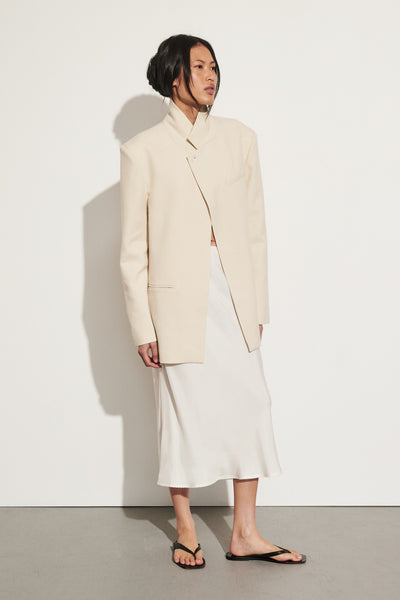 Ploy wearing ARELIA WHITE CUPRO MIDI SKIRT