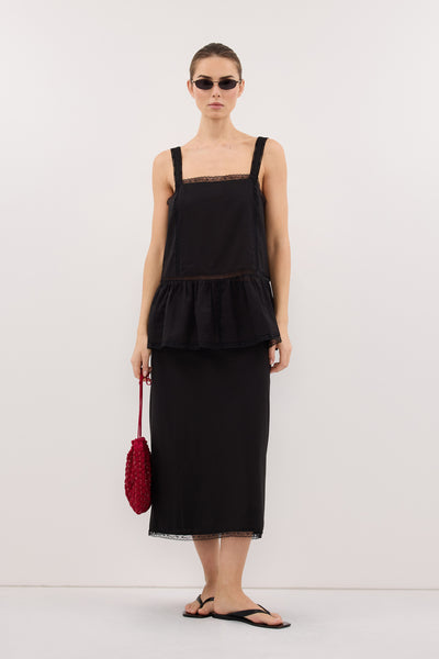 Stas wearing ROSIN BLACK KNEE LENGTH SKIRT