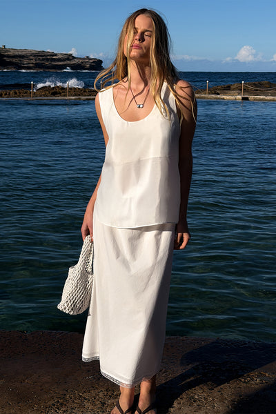 Zoe wearing ROSIN WHITE KNEE LENGTH SKIRT
