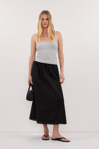 Zoe wearing ARLETTE BLACK COTTON GATHERED 7/8 SKIRT