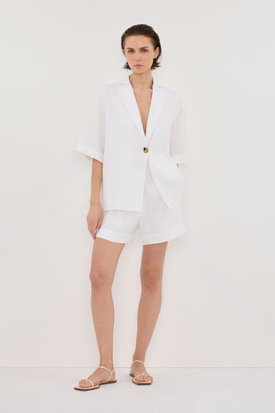 Stas wearing ALONDRA WHITE LINEN SHORT