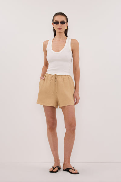 Stas wearing LUNE TAN LINEN SHORT