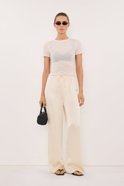 Stas wearing MYA CREAM SATIN PANT
