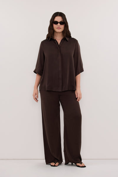 Jasmine wearing PERCY BITTER CHOC SILK PANT