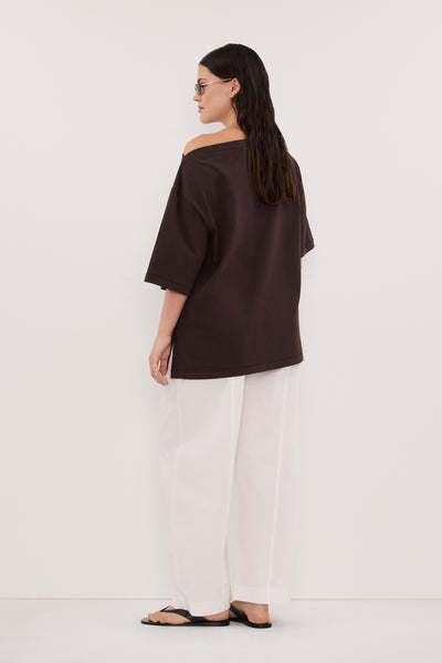 Stas wearing SCOUT WHITE COTTON BARREL LEG PANT