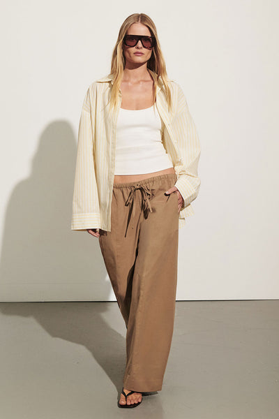 Zoe wearing SCOUT WHEAT COTTON BARREL LEG PANT