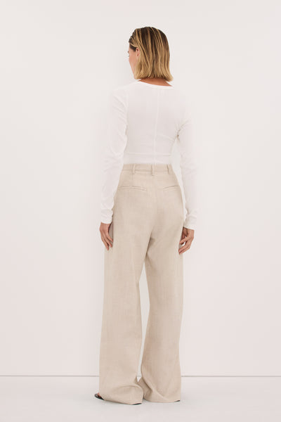Stas wearing CYRUS NATURAL TAILORED PANT