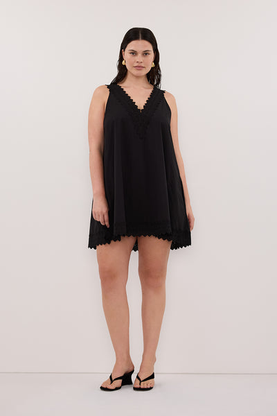 Jasmine wearing ANNABEL BLACK SLEEVELESS V NECK MINI DRESS