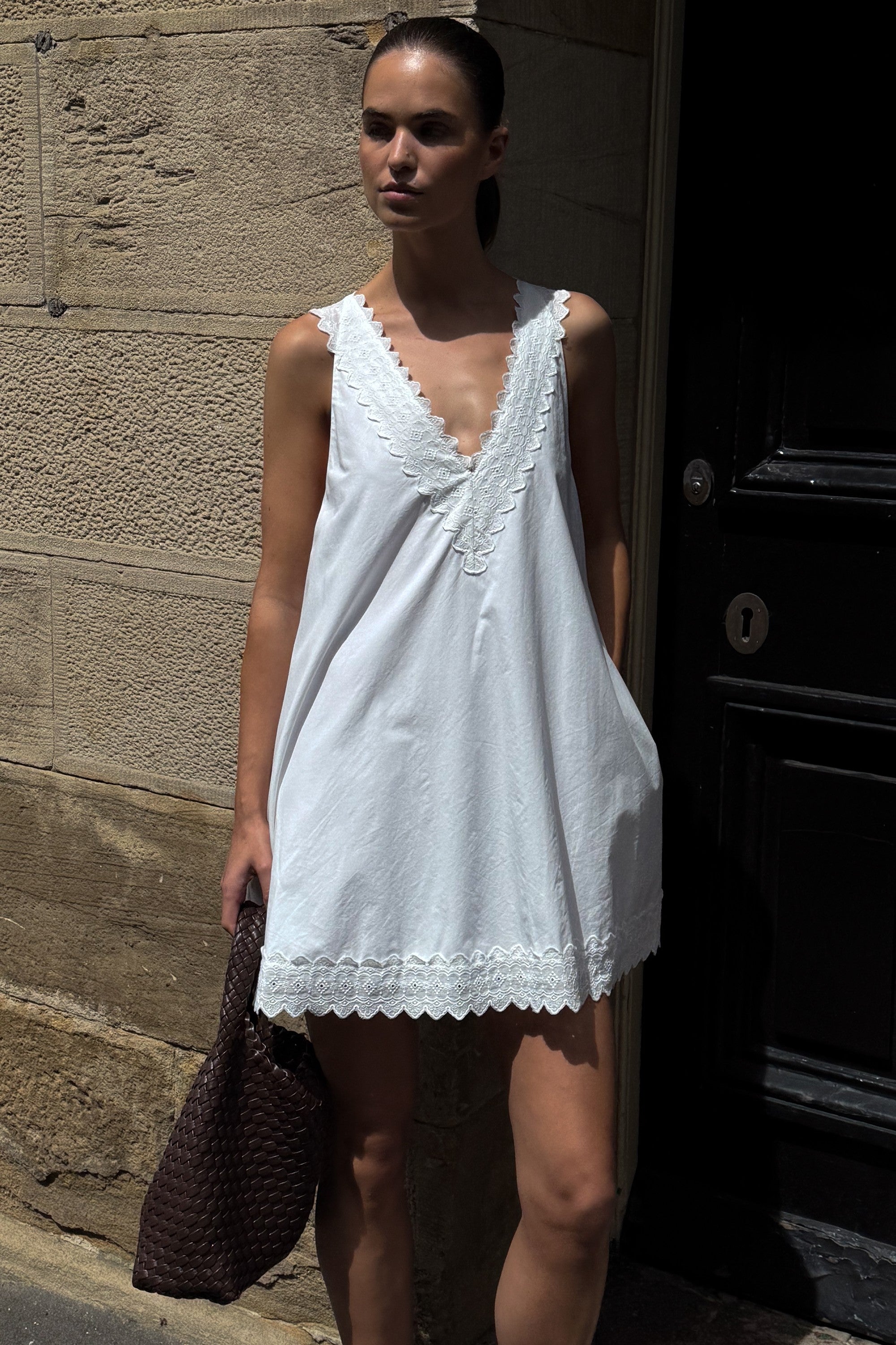Annabel Sleeveless V Neck Mini Dress in White By DISSH Annabel Sleeveless V Neck Mini Dress in White By DISSH