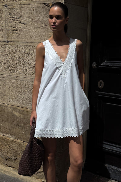 Robin wearing ANNABEL WHITE SLEEVELESS V NECK MINI DRESS
