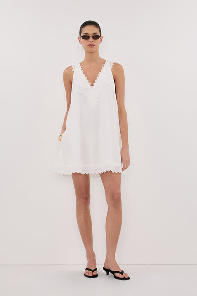 Aude wearing ANNABEL WHITE SLEEVELESS V NECK MINI DRESS