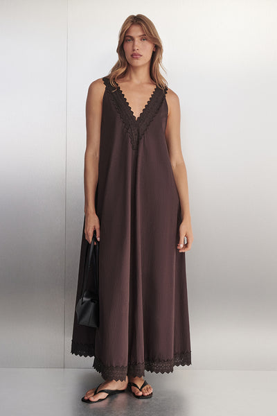 Yulia wearing ANNABEL BURNT CHOC SLEEVELESS V NECK MIDI DRESS