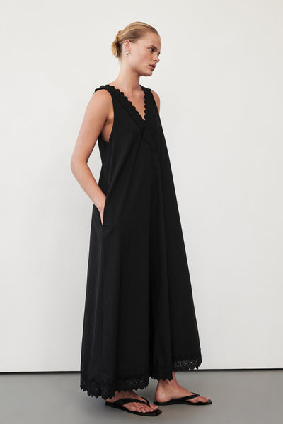 Zoe wearing ANNABEL BLACK SLEEVELESS V NECK MIDI DRESS