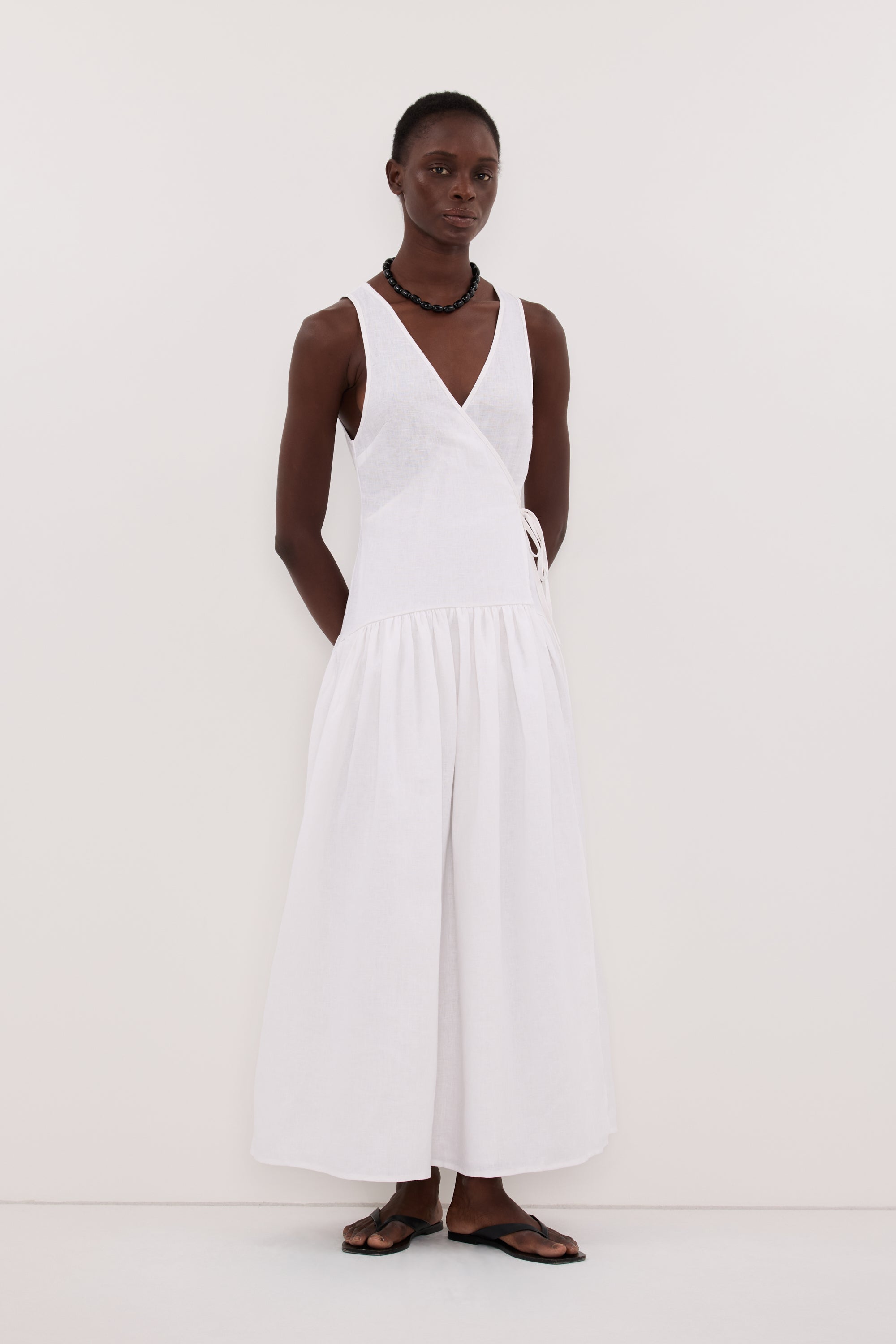 Ilio Sleeveless Linen Wrap Midi Dress in White By DISSH