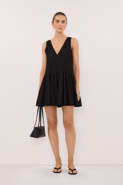Stas wearing PIXIE BLACK LINEN MINI GODET DRESS