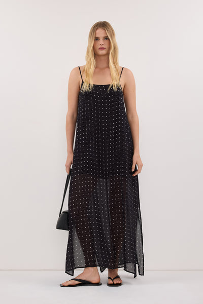 Zoe wearing VANESSA BLACK SLEEVELESS MIDI DRESS