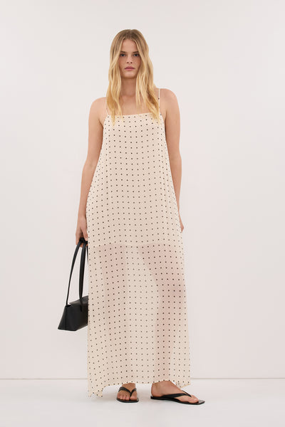 Zoe wearing VANESSA SANDSTONE SLEEVELESS MIDI DRESS