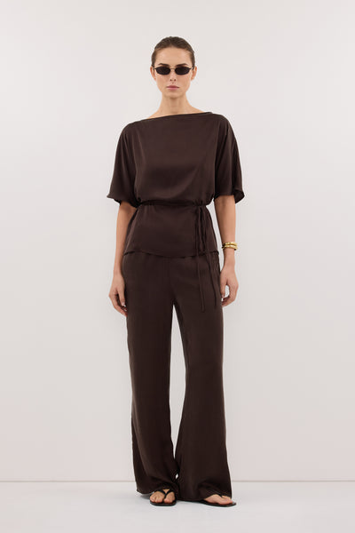 Stas wearing CORY BITTER CHOC SILK ASYM BATWING TOP