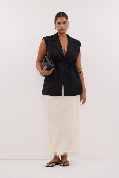 Amanda wearing CYRUS BLACK SLEEVELESS WRAP VEST