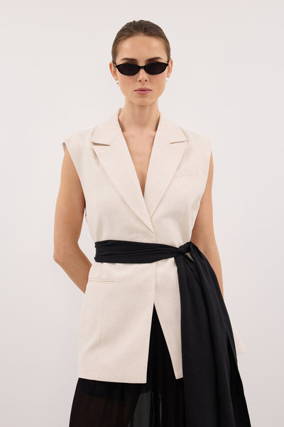 Stas wearing ROSALIE CREAM MARLE WRAP VEST
