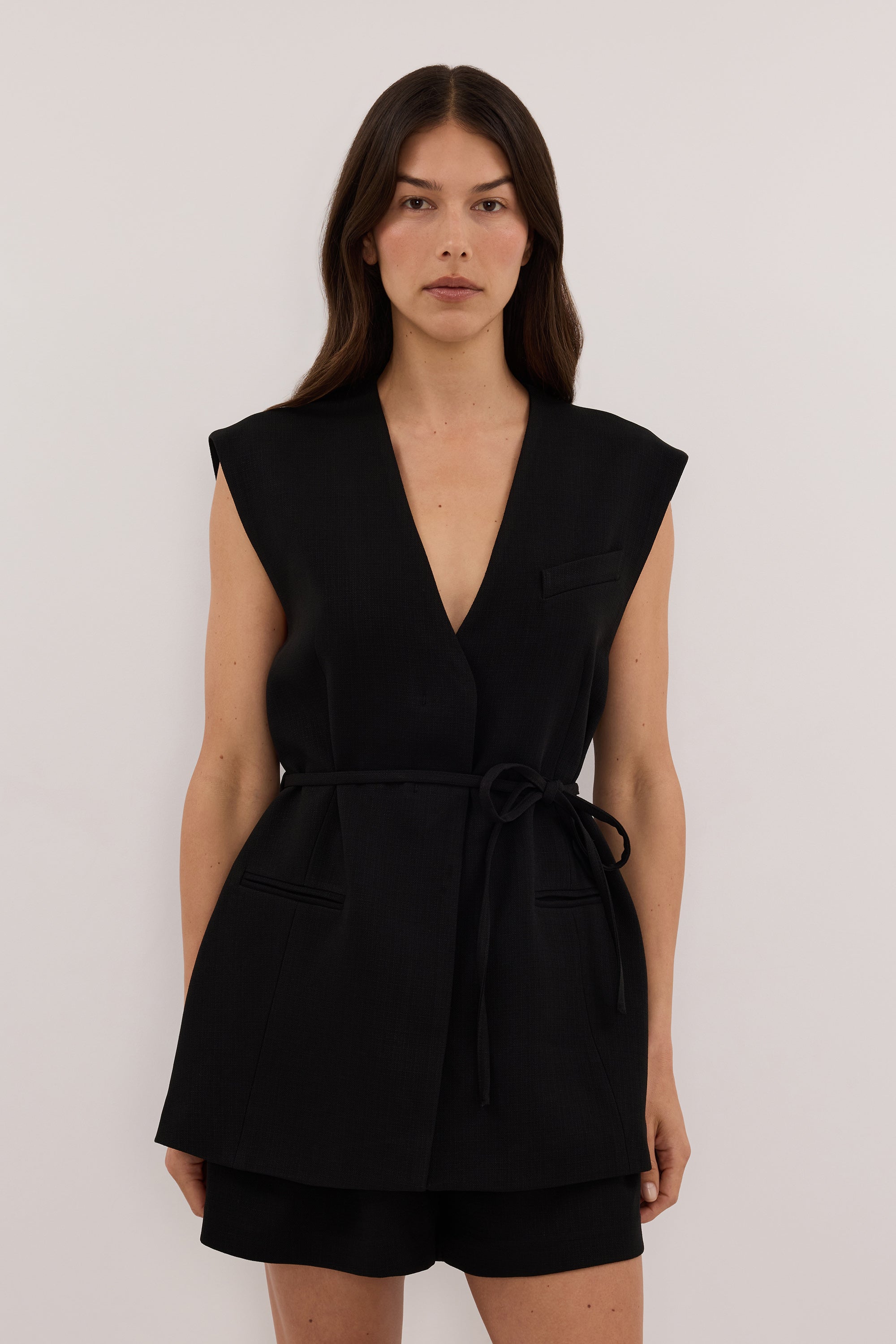 EMORY BLACK COLLARLESS PEPLUM VEST