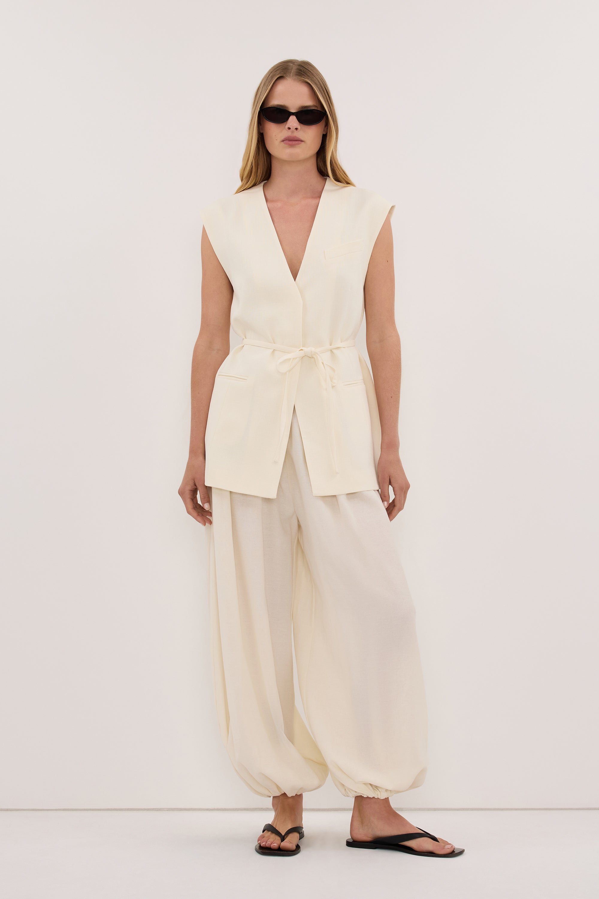 EMORY CREAM COLLARLESS PEPLUM VEST